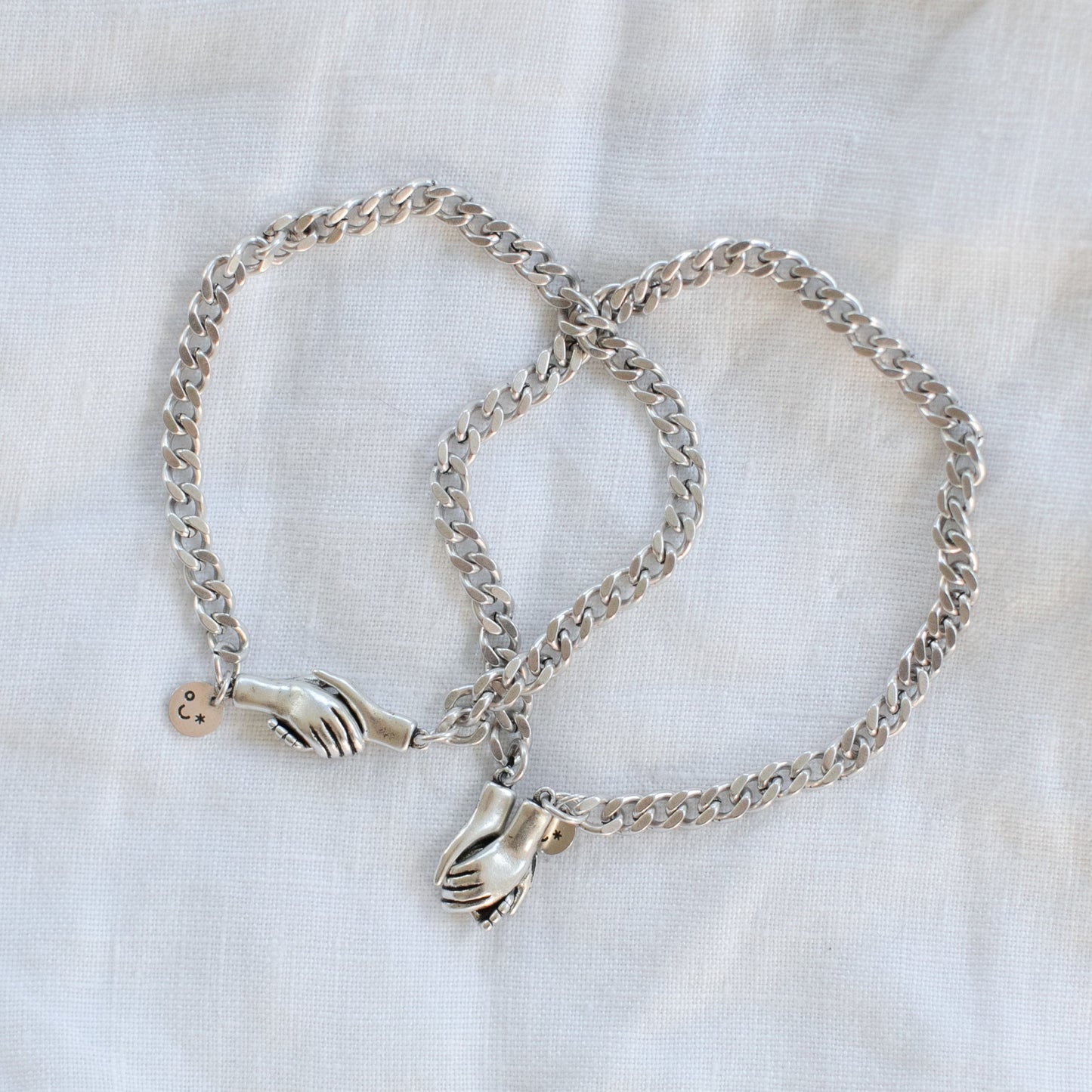 the hand clasp  bracelet