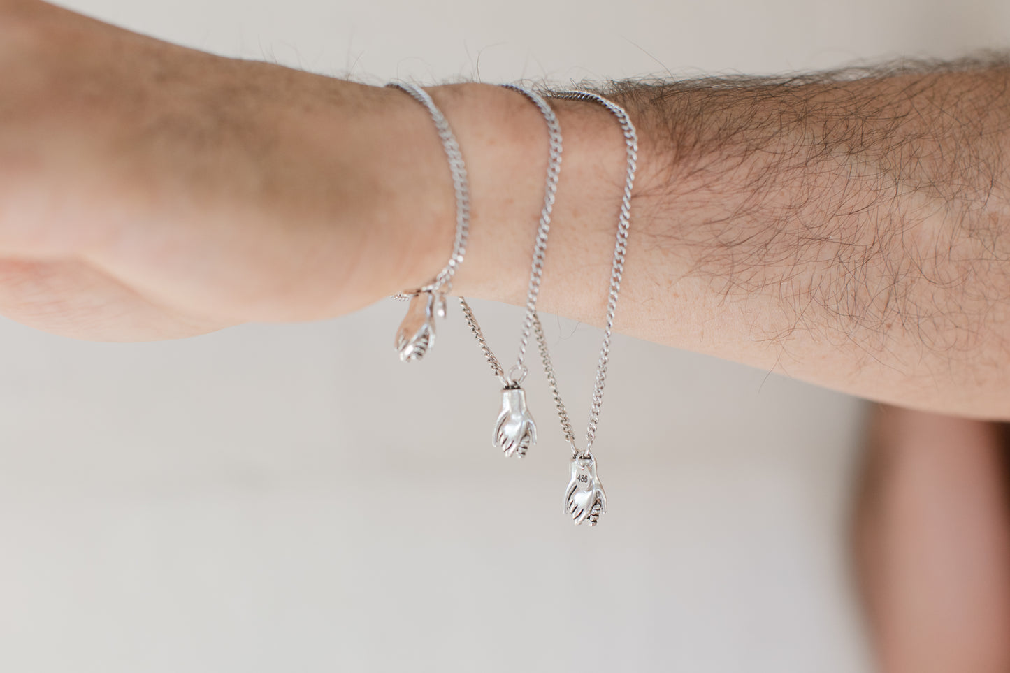 the hand clasp  bracelet