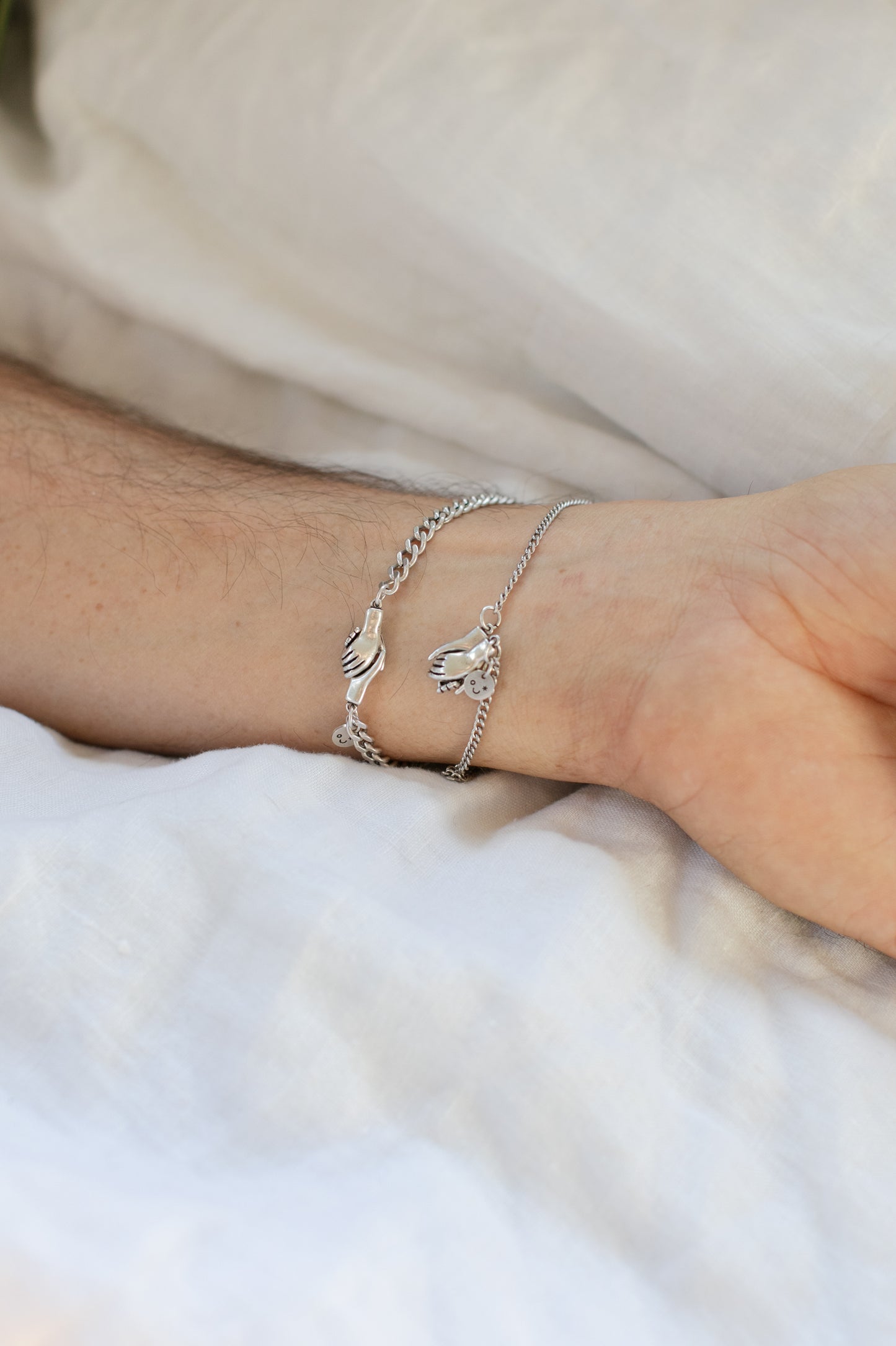 the hand clasp  bracelet