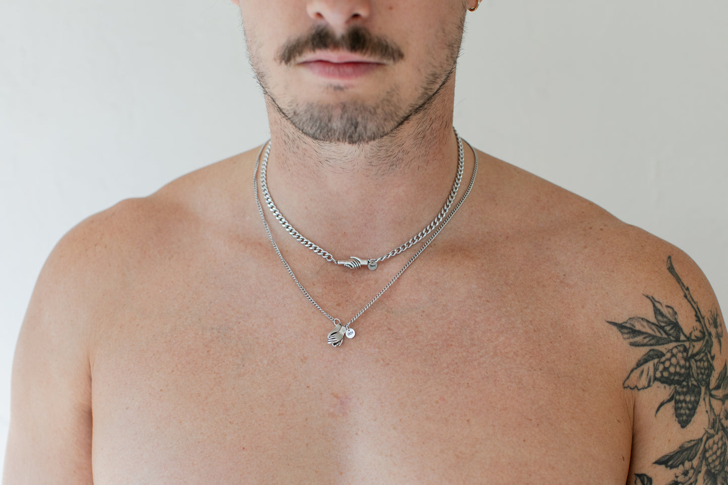 the hand clasp necklace